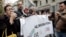 Journalists stage a protest, Nov. 13, 2018 in Milan and across Italy against insults from prominent figures in the governing 5-Star Movement.