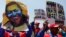 Demonstrators hold a poster of late Venezuelan President Hugo Chavez during a rally to show their support for Venezuela's President Nicolas Maduro's government in Caracas March 22, 2014. Two Venezuelans died from gunshot wounds during protests against Mad