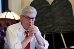 FILE - Then-Gov. Phil Bryant sits in his Jackson, Miss., Capitol office, Jan. 8, 2020.