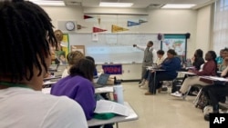 FILE - Emmitt Glynn teaches to a group of Baton Rouge Magnet High School students, Jan. 30, 2023, in Baton Rouge, La. The College Board released an updated framework for its new Advanced Placement African American Studies course. (AP Photo/Stephen Smith, File)