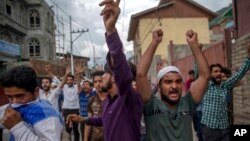 Supporters of Jammu Kashmir Liberation Front (JKLF) shout slogans during a protest march towards UN Military Observer Group headquarters in Srinagar, Indian controlled Kashmir, July 21, 2017.