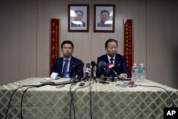 FILE - Ambassador of the Permanent Mission of the Democratic People's Republic of Korea to the United Nations Jang Il Hun, right, is joined by Kwon Jong Gun at a news conference at the DPRK mission in New York, July 28, 2015.