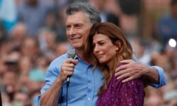 FILE - Argentina's President Mauricio Macri and his wife, Juliana Awada, react during a rally in support of Macri, in Buenos Aires, Argentina, Dec. 7, 2019. He lost to opposition candidate Alberto Fernandez.