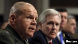 FILE - Commandant of the U.S. Marine Corps Gen. Robert Neller (L) testifies during a Senate Armed Services Committee hearing on Capitol Hill in Washington, Feb. 2, 2016. 