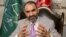 FILE - Atta Mohammad Noor, governor of the Balkh province, talks during an interview with The Associated Press at his home in Kabul, Afghanistan, Aug. 3, 2015. 