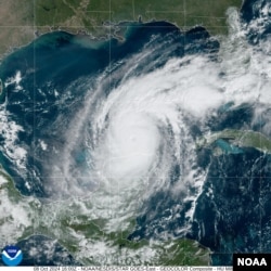 This satellite image by NOAA shows the location of Hurricane Milton on Oct. 8, 2024. It is moving ENE at 9 mph with the minimum sustained winds of about 150 mph.