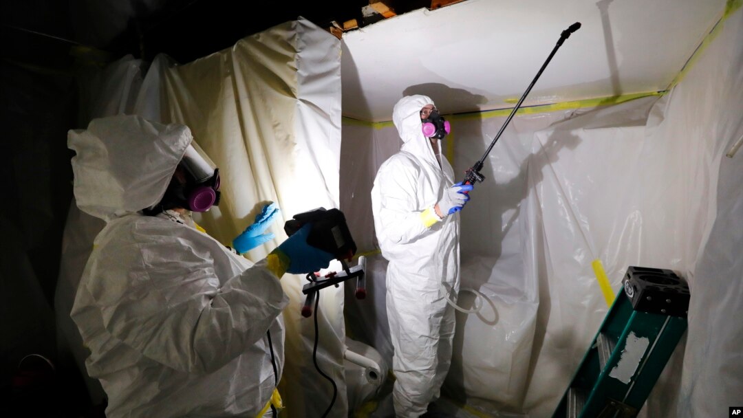 Asbestos Removal Technologies Inc. technicians are seen performing asbestos abatement in Howell, Michigan, Oct. 18, 2017.