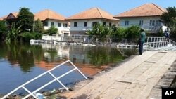 Flooded Bridge on West Side of Prapa Canal, just outside Bangkok border, October, 31, 2011.