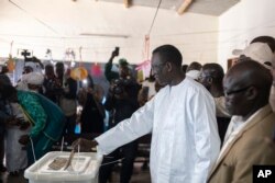 FILE —Presidential candidate Amadou Ba casts his vote inside a polling station during the presidential elections, in Dakar, Senegal, March 24, 2024.