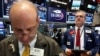 Traders work on the floor of the New York Stock Exchange in New York City, Aug. 25, 2016. 