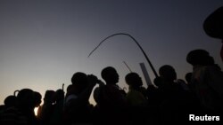 Miners gather for a report back on negotiations at South Africa's Lonmin's Marikana mine August 29, 2012.