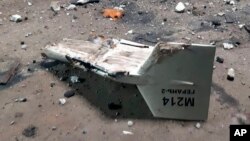 FILE - This undated photograph released by the Ukrainian military's Strategic Communications Directorate shows the wreckage of what Kyiv has described as an Iranian Shahed drone downed near Kupiansk, Ukraine. 
