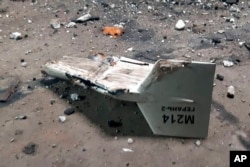 FILE - This undated photograph released by the Ukrainian military's Strategic Communications Directorate shows the wreckage of what Kyiv has described as an Iranian Shahed drone downed near Kupiansk, Ukraine.