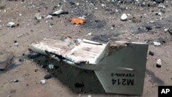 FILE - This undated photograph released by the Ukrainian military's Strategic Communications Directorate shows the wreckage of what Kyiv has described as an Iranian Shahed drone downed near Kupiansk, Ukraine. 