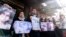 Activists and relatives take part in a protest demanding the whereabouts of four activists who disappeared during the war between opposition groups and former President Bashar al-Assad's forces, in Douma, Syria, Jan. 1, 2025.