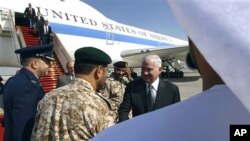 Defense Secretary Robert Gates is greeted upon arrival in Abu Dhabi, UAE, 09 Dec 2010