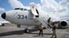 FILE -A U.S. P-8A Poseidon reconnaissance plane in shown at Clark Air Base, Pampanga province, northern Philippines on March 20, 2022. China said it deployed forces to warn and monitor a U.S. P-8A that flew threw the Taiwan Strait Tuesday.