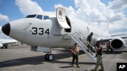 FILE -A U.S. P-8A Poseidon reconnaissance plane in shown at Clark Air Base, Pampanga province, northern Philippines on March 20, 2022. China said it deployed forces to warn and monitor a U.S. P-8A that flew threw the Taiwan Strait Tuesday.