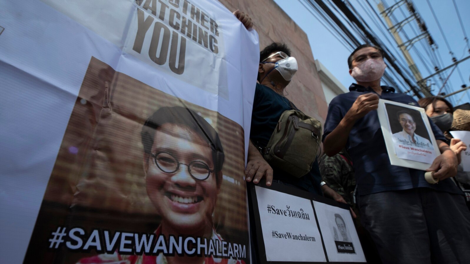 Activists hold photos of Thai dissident Wanchalearm Satsaksit gather for a rally in front of Cambodian Embassy in Bangkok, Thailand, June 8, 2020. 