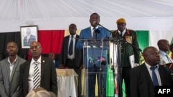 Zimbabwean President Emmerson Mnangagwa delivers a speech during a rally with Zimbabwean businessmen and foreign investors at the Zimbabwean embassy in Pretoria, South Africa, Dec. 21, 2017.