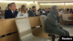 FILE - China's Xinjiang region's Vice-Governor Erkin Tuniyaz attends the Human Rights Council meeting at the United Nations in Geneva, June 25, 2019.