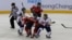 South Korea, wearing white uniforms, and North Korean players compete during their IIHF Ice Hockey Women's World Championship Division II Group A game in Gangneung, South Korea, April 6, 2017. 