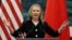FILE - U.S. Secretary of State Hillary Clinton speaks during her joint conference with Chinese Foreign Minister Yang Jiechi at the Great Hall of the People in Beijing.