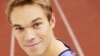 Olympian Nick Symmonds sports the Hanson Dodge Creative logo, after the company won an eBay auction on his left shoulder.