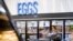 FILE - A woman buys eggs at a Walmart Superstore in Secaucus, New Jersey, July 11, 2024.