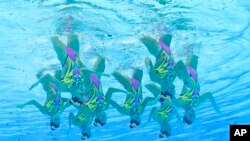 The Italy artistic swimming team competes during the team technical routine at the 2020 Summer Olympics, in Tokyo, Japan. 