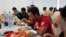 FILE: Algerians break their fast at a charity food distribution center by humanitarian association Ihcene on the outskirts of Algiers July 30, 2013. Ihcene launched a charity food distribution center during Ramadan, the holiest month in the Islamic calendar.