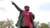Red paint covers a statue of Christopher Columbus, Oct. 14, 2019, in Providence, R.I., after it was vandalized on the day named to honor him as one of the first Europeans to reach the New World. 