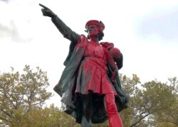 Red paint covers a statue of Christopher Columbus, Oct. 14, 2019, in Providence, R.I., after it was vandalized on the day named to honor him as one of the first Europeans to reach the New World.