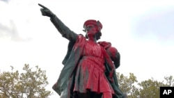 Red paint covers a statue of Christopher Columbus, Oct. 14, 2019, in Providence, R.I., after it was vandalized on the day named to honor him as one of the first Europeans to reach the New World. 