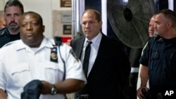 Harvey Weinstein, center, leaves a courtroom following an appearance for a scheduled arraignment, Aug. 26, 2019, in New York. 