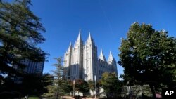 FILE - The Salt Lake Temple, at Temple Square, is shown before the start of The Church of Jesus Christ of Latter-day Saints' twice-annual church conference Saturday, Oct. 5, 2019, in Salt Lake City.