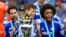 Football - Chelsea v Sunderland - Barclays Premier League - Stamford Bridge - 24/5/15Chelsea's Cesc Fabregas, Cesar Azpilicueta and Willian as they celebrate winning the Barclays Premier League with the trophyReuters / Dylan MartinezLivepicEDITORIAL USE O