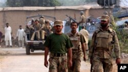 Pakistan army soldiers arrive at the mosque attacked by suicide bomber in Darra Adam Khel, 35 kilometer (21 miles) south of Peshawar, Pakistan, 05 Nov 2010