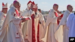 Bishop Juan Barros (2nd-R) arrives to attend a Mass celebrated by Pope Francis at the Maquehue Air Base in Temuco, Chile, Jan. 17, 2018. 