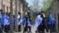 Participants of the yearly March of the Living walk through a barbed wire fence in the former German Nazi Death Camp Auschwitz-Birkenau, in Oswiecim, Poland, April 24, 2017. 