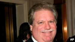FILE - In this Feb. 27, 2008, photo, Elliott Broidy poses for a photo at an event in New York.