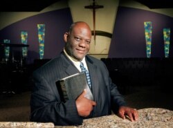 FILE - The Rev. Dwight McKissic poses for a portrait in the sanctuary of the Cornerstone Baptist Church in Arlington, Texas, Oct. 4, 2006.
