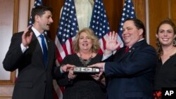 FILE - House Speaker Paul Ryan of Wis. administers the House oath of office to Rep. Blake Farenthold, R-Texas, during a mock swearing in ceremony on Capitol Hill in Washington, Jan. 3, 2017.