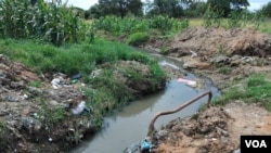 Sewer water with human waste flowing in some suburbs. In some cases, this has been worsened by heavy rains.