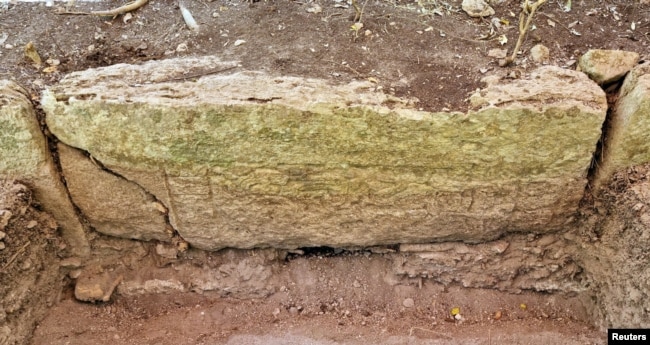 FILE - A view shows a part of an engraved stone after archaeologists from Mexico's National Institute of Anthropology and History (INAH) discovered an ancient Mayan city inside the Balamku ecological reserve in Campeche state, Mexico. (Mexico's National Institute of Anthropology and History/Handout via REUTERS)