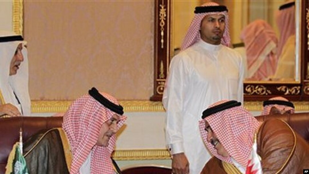 Saudi FM Prince Saudi al-Faisal, left, speaks with Bahrain's FM Sheikh Khaled bin Ahmad al-Khalifa, left, before the foreign ministers of the Gulf Cooperation Council 'GCC', in Riyadh, Saudi Arabia, May 1, 2011