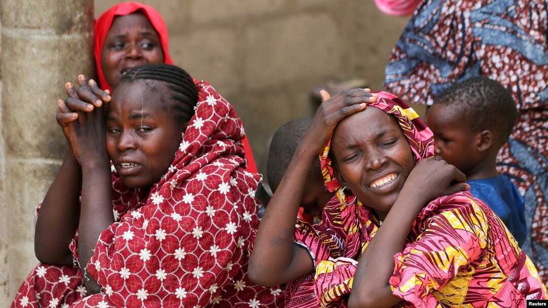 Relatives of missing school girls react in Dapchi in the northeastern state of Yobe, after an attack on the village by Boko Haram, Nigeria, Feb. 23, 2018. 