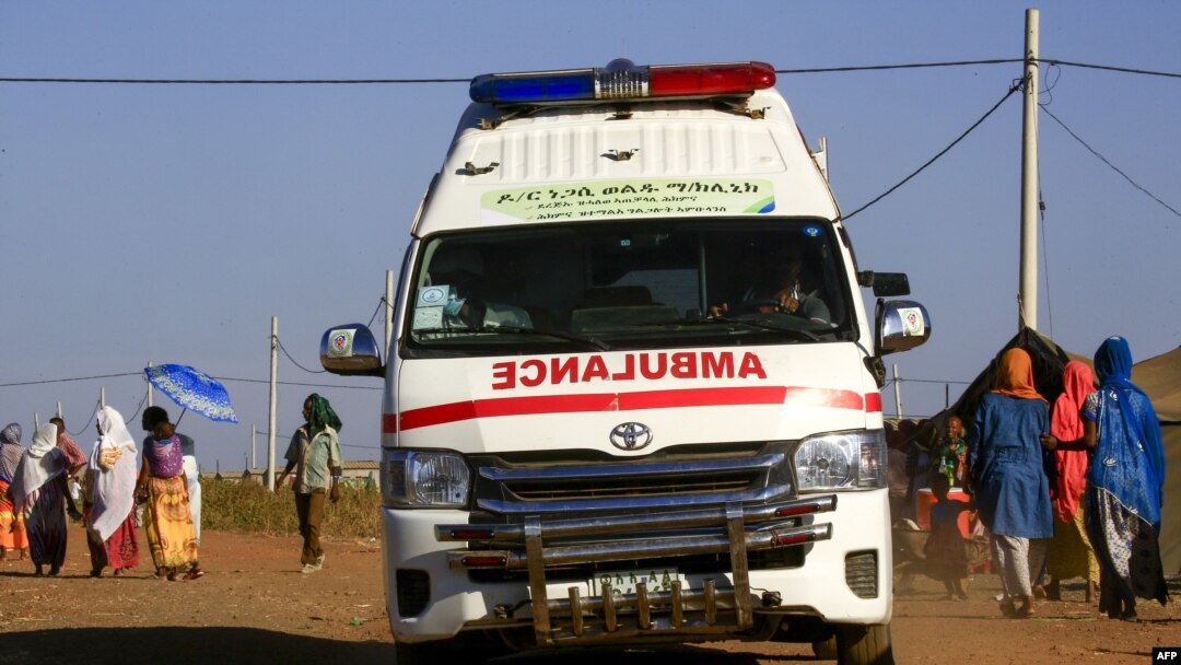An ambulance drives in a border reception center housing Ethiopian refugees who fled the fighting in Tigray Region, in Sudan's eastern Gedaref State on November 29, 2020.
