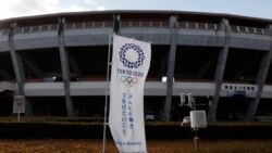 A Tokyo 2020 banner stands in front of the Azuma Baseball Stadium, a venue for baseball and softball at the Tokyo 2020 Olympics, Saturday, Nov. 30, 2019, in Fukushima, Fukushima prefecture, Japan. The torch relay for the Tokyo Olympics will kick off…