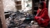 Hena Tabassum, 20, at her house in Telinipara, two days after it was attacked by Hindus. The attackers threw Molotov cocktails to set it on fire and used a gas cylinder to trigger a big explosion. (Shaikh Azizur Rahman/VOA)
